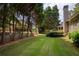 This cozy backyard is surrounded by fences creating an outdoor oasis with lots of privacy at 9975 Groomsbridge Rd, Johns Creek, GA 30022