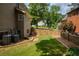 The well-maintained backyard features a secure privacy fence and a lush lawn, providing a safe and enjoyable outdoor space at 9975 Groomsbridge Rd, Johns Creek, GA 30022