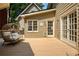 Deck with french doors, siding, a porch swing, and a dog door to the house at 9975 Groomsbridge Rd, Johns Creek, GA 30022