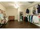 Finished basement showing a closet area with wood floors and plenty of storage at 9975 Groomsbridge Rd, Johns Creek, GA 30022