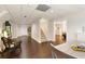 Finished basement showcasing wood floors, neutral walls, and an open floorplan at 9975 Groomsbridge Rd, Johns Creek, GA 30022