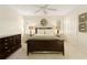 Comfortable bedroom with plush carpet, neutral color palette, and minimalist decor creates a serene and relaxing retreat at 9975 Groomsbridge Rd, Johns Creek, GA 30022