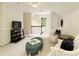 Comfortable bonus room with vaulted ceiling, neutral carpet, and cozy seating provides a versatile and inviting space at 9975 Groomsbridge Rd, Johns Creek, GA 30022
