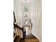 View from the top of the stairs of the foyer which features tall ceilings and hardwood floors at 9975 Groomsbridge Rd, Johns Creek, GA 30022