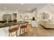 Bright kitchen with wooden breakfast bar, stainless steel appliances, and hardwood flooring at 9975 Groomsbridge Rd, Johns Creek, GA 30022