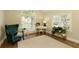 Inviting living room featuring a large window, hardwood floors, and neutral decor at 9975 Groomsbridge Rd, Johns Creek, GA 30022