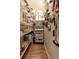 Organized pantry with lots of shelving with food items and various cooking supplies at 9975 Groomsbridge Rd, Johns Creek, GA 30022