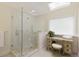 Walk-in shower with glass door and tiled floor and built-in shelving at 9975 Groomsbridge Rd, Johns Creek, GA 30022