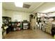 Unfinished basement storage room with shelves and packed moving boxes at 9975 Groomsbridge Rd, Johns Creek, GA 30022