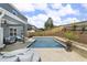 Spacious backyard features a modern pool, patio area, and fenced yard at 244 Citrine Way, Acworth, GA 30101