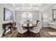 Bright dining room featuring a round table, stylish decor, and hardwood floors at 244 Citrine Way, Acworth, GA 30101