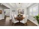 Formal dining room with a round table, chandelier, and coffered ceiling at 244 Citrine Way, Acworth, GA 30101