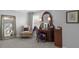 Elegant dressing area featuring a vanity, ornate mirrors, and a comfortable accent chair at 244 Citrine Way, Acworth, GA 30101