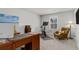 Cozy home office with a wooden desk, comfortable chair, workout equipment, and a serene beach art piece at 244 Citrine Way, Acworth, GA 30101