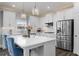 Modern kitchen with white cabinets, quartz countertops, stainless steel appliances and center island at 244 Citrine Way, Acworth, GA 30101