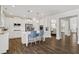 Bright, open kitchen featuring stainless steel appliances, a kitchen island, and a view to the living areas at 244 Citrine Way, Acworth, GA 30101