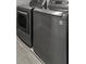 Modern laundry room equipped with a gray front-load washer and dryer set at 244 Citrine Way, Acworth, GA 30101
