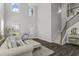 Elegant living room with soaring ceilings, a staircase, and contemporary decor at 244 Citrine Way, Acworth, GA 30101