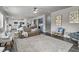 Bright living room featuring a plush rug and a stylish tufted sofa at 244 Citrine Way, Acworth, GA 30101