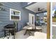 Outdoor patio area with grill, furniture, and fan for comfort and entertainment at 244 Citrine Way, Acworth, GA 30101