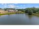 Scenic pond view with community buildings in the background on a sunny day at 515 Provence Gate Ln, Lawrenceville, GA 30044
