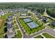 Aerial view showcasing community amenities with tennis courts, playground, and an elegant swimming pool for residents at 7420 Wild Violet Dr, Cumming, GA 30040