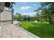 Expansive backyard with lush green lawn, and tranquil lake view at 7420 Wild Violet Dr, Cumming, GA 30040