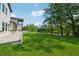 Lush backyard with expansive lawn leading to the lake at 7420 Wild Violet Dr, Cumming, GA 30040