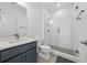 Modern bathroom features a glass-enclosed shower, sleek vanity, and contemporary fixtures, creating a spa-like retreat at 7420 Wild Violet Dr, Cumming, GA 30040