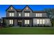 Beautiful exterior of a two-story home with a landscaped front yard and inviting front porch at 7420 Wild Violet Dr, Cumming, GA 30040