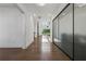 Bright foyer with hardwood floors, high ceilings and natural light entering through large windows at 7420 Wild Violet Dr, Cumming, GA 30040