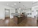 Modern kitchen with stainless steel appliances, spacious island, and ample storage at 7420 Wild Violet Dr, Cumming, GA 30040