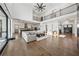 Expansive living room with open floor plan, fireplace, and access to kitchen at 7420 Wild Violet Dr, Cumming, GA 30040