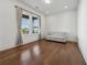 Bright living room featuring hardwood floors and a comfortable sofa at 7420 Wild Violet Dr, Cumming, GA 30040
