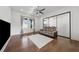 Contemporary room with hardwood floors, large windows, a comfortable couch, and a glass sliding-door closet at 7420 Wild Violet Dr, Cumming, GA 30040