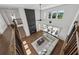 Spacious living room featuring a fireplace, large windows, and a comfortable couch, creating a cozy atmosphere at 7420 Wild Violet Dr, Cumming, GA 30040