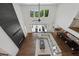A modern open floorplan with a fireplace, a large sectional sofa, and a kitchen island, creating an inviting space at 7420 Wild Violet Dr, Cumming, GA 30040