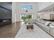 Spacious living room with fireplace, high ceilings, and abundant natural light at 7420 Wild Violet Dr, Cumming, GA 30040