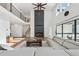 Inviting living room featuring a fireplace, high ceilings, and open layout at 7420 Wild Violet Dr, Cumming, GA 30040