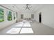 Sunlit main bedroom with tray ceiling, large windows, and neutral carpet, creating a spacious and airy feel at 7420 Wild Violet Dr, Cumming, GA 30040