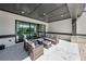 Covered patio with comfortable seating, perfect for relaxation and entertaining at 7420 Wild Violet Dr, Cumming, GA 30040
