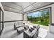 Stylish covered patio provides stunning outdoor living with a beautiful lake view at 7420 Wild Violet Dr, Cumming, GA 30040