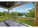 Covered porch with tranquil views of the lake at 7420 Wild Violet Dr, Cumming, GA 30040