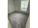 Bedroom featuring carpet and a large window at 10630 Worthington Hills Mnr, Roswell, GA 30076