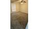 Bedroom featuring carpet, a ceiling fan, and a window at 10630 Worthington Hills Mnr, Roswell, GA 30076
