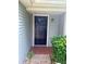 Inviting front entrance with a modern black door and manicured landscaping at 10630 Worthington Hills Mnr, Roswell, GA 30076