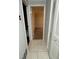 Tiled hallway with white doors at 10630 Worthington Hills Mnr, Roswell, GA 30076