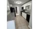 Modern kitchen with granite counters, white cabinets, and stainless steel appliances at 10630 Worthington Hills Mnr, Roswell, GA 30076