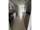 Bright kitchen features stainless steel appliances and white cabinets at 10630 Worthington Hills Mnr, Roswell, GA 30076