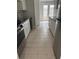 Bright kitchen features stainless steel appliances and white cabinets at 10630 Worthington Hills Mnr, Roswell, GA 30076